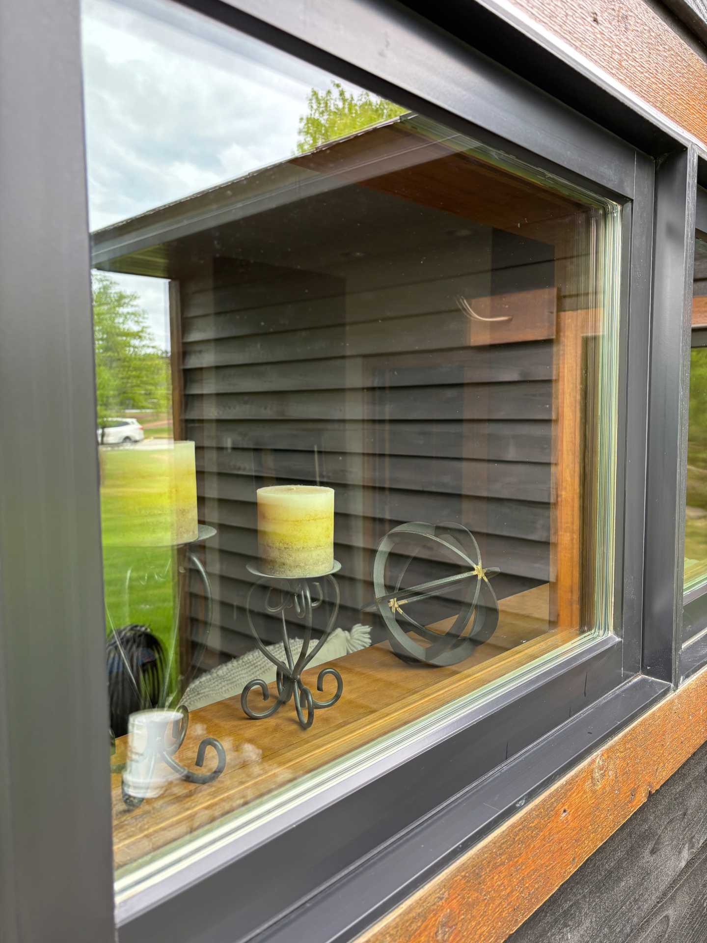 After photo of the same dark framed modern window after cleaning